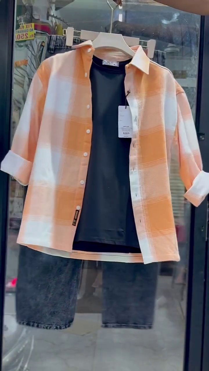 🧡 Relaxed Peach & White Check Button-Down Overshirt Layered With Black T-Shirt and Dark Denim for Everyday Casual Style